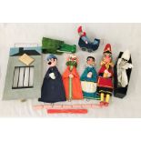 A vintage Punch and Judy set by Bob (Robert) Wade comprising of Punch, Judy, baby in pram,