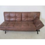 A leather effect sofa bed.