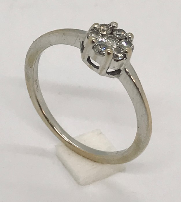 An 18ct white gold diamond cluster ring