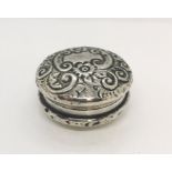 A hallmarked silver pill box