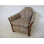 An Art Deco armchair with walnut veneered detailing