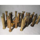 A collection of vintage wooden bobbins