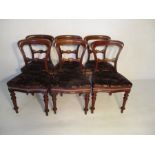 A set of six Victorian balloon back dining chairs