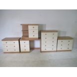 A bedroom suite comprising of three sets of chest of drawers, bedside cabinet, dressing table and