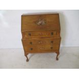 A Walnut veneer bureau with painted decoration