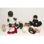 A collection of vintage dolls and toys