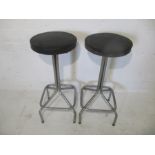 Two vintage bar stools.