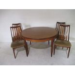 A mid-century extendable dining table with four chairs - 1 chair A/F