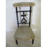 A Victorian Prie Dieu ebonised chair with bobbin turned supports