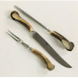 An antler handled three piece carving set by Garrard & Co London