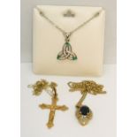 A 9ct gold Crucifix on fine chain, a 9ct gold sapphire and diamond pendant on chain and an SCM