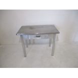 A stainless steel topped table with aluminium base made by C.S.A industries ltd - W106cm D66cm