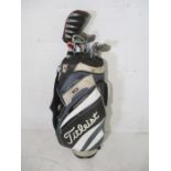 A set of right-handed Titleist Dci 762 golf clubs in matching carry bag. Clubs included are a