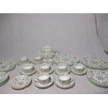 A Minton Haddon Hall part tea set including a six plates, six trios, six side plates, teapot and