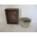 A Belfast sink along with a concrete garden pot