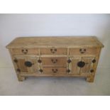 A pine dresser base with Chinese style door furniture L159cm H81cm D45cm