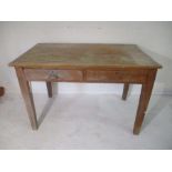 A farmhouse table with two drawers