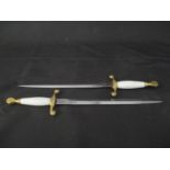A pair of Wilkinson Sword presentation daggers with gilt mounted handles, overall length 40cm