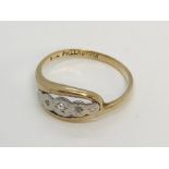 A 9ct gold ring with palladium set with diamond chips