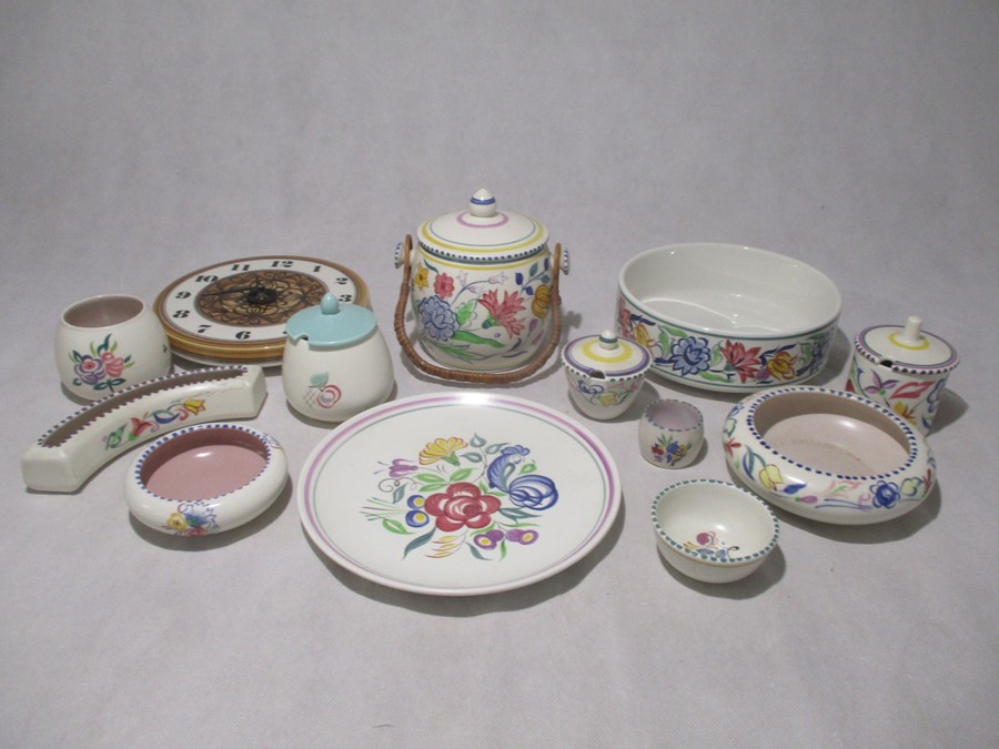 A collection of Poole Pottery including a biscuit barrel, pots, plate, bowl etc