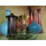 An assortment of ten coloured pieces of glassware including Mdina, SC line and Cranberry.
