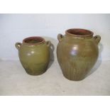 Two glazed terracotta garden urns