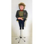 A mid-century American made ventriloquist's dummy with paper mache head and feet, moving eyes and