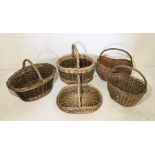 A collection of five wicker baskets
