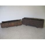 Two industrial packing crates or planters from Axminster Carpets Factory, one has a metal plaque