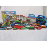 A collection of Thomas the Tank Engine die cast pieces along with various other model vehicles etc.