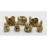 A collection of 7 late 19th Century Netsukes carved from ivory and bone including Shou Lao figures