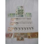 Twenty eight consecutive numbered £10 notes along with two others, twelve £1 notes, two ten shilling