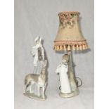 A Lladro figure of a lady with a parasol and Borzoi along with a Zaphir table lamp of a young boy