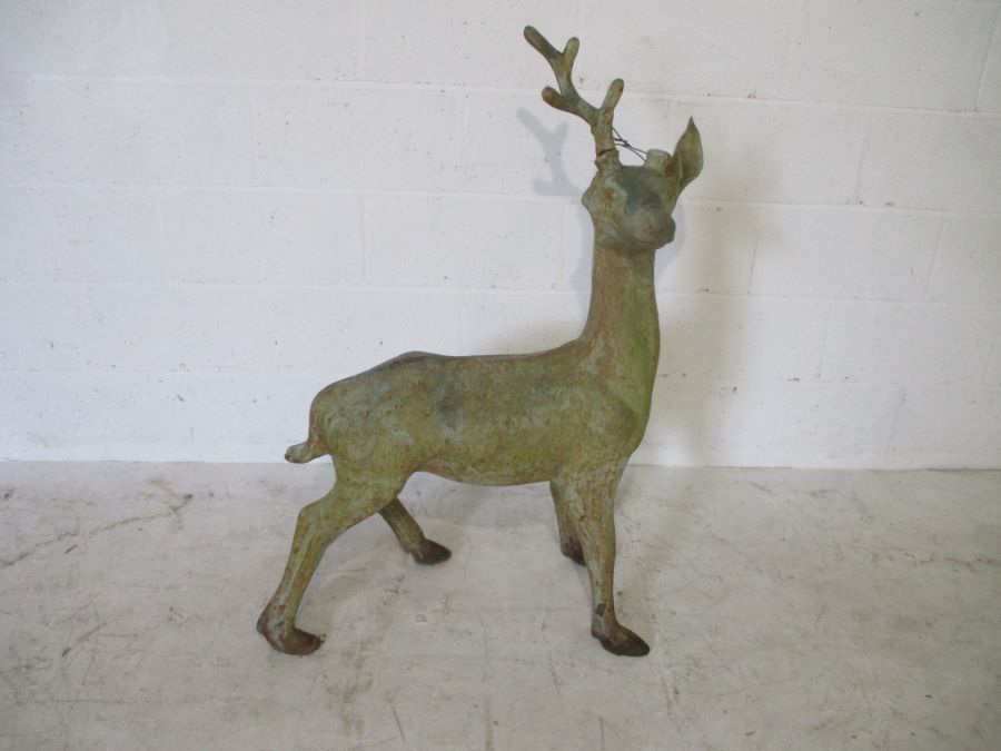 A cast iron model of a stag ( 1 antler missing, 1 ear missing) height 107cm
