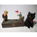 A reproduction cast iron money box "Birdie Putt" along with a vintage plush cat