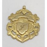 A silver gilt medallion hallmarked for Birmingham 1907, weight 8.4g