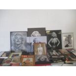 A large collection of Marilyn Monroe memorabilia including books, pictures, a jigsaw etc plus a