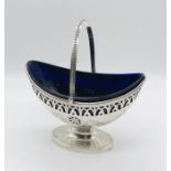 A Georgian hallmarked silver sugar basket with blue glass liner, silver weight 184g ( 5.92 troy