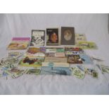 A collection of tea cards, cigarette cards etc.