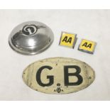 A mid-1920`s oval GB plate with AA markings along with two AA badges and a Daimler hubcap