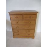 A modern pine chest of six drawers