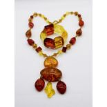 An amber fleck necklace along with a similar bracelet