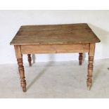 A pine farmhouse table with single drawer - some boards loose on top