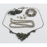 A 925 silver rope chain along with a silver marcasite brooch/ buckle, various silver brooches etc.