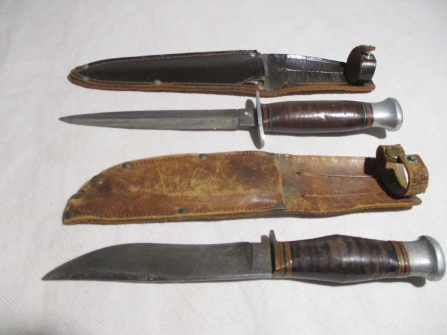 An Underhill & Co. knife in leather sheath along with a Commando style dagger( possibly by William
