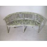A lichen covered curved bench, 160cm width