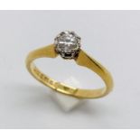 A diamond solitaire ring set in 18ct gold