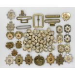 A collection of military badges, buttons etc.