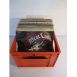 A collection of 12" vinyl records including Meat Loaf, The Hollies, Blondie, The Eagles, Phil