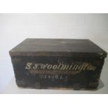 A vintage metal bound wooden trunk. Painted inscription to front reads S J Woolmington 2/4 Som L